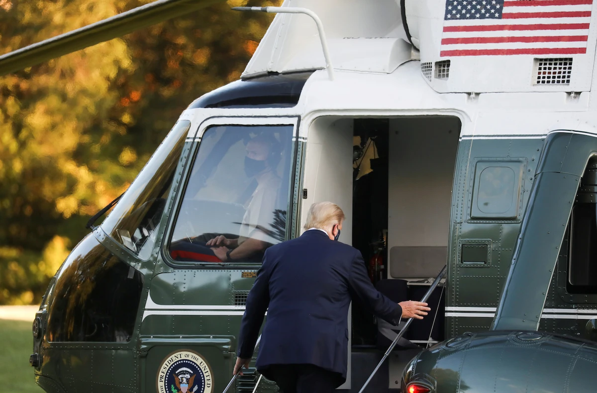 Trump boards the Marine One helicopter to depart the White House and fly to Walter Reed National Military Medical Center on Oct. 2. (Reuters)