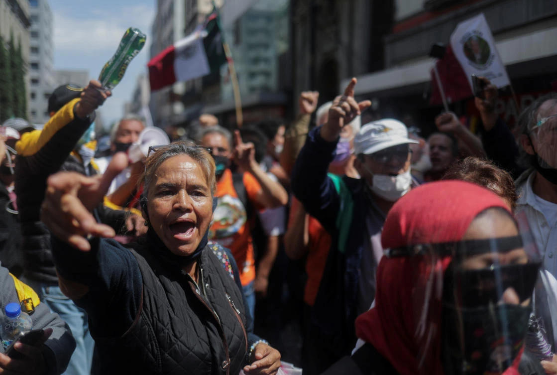 Supporters of Mexico’s President Andres Manuel Lopez Obrador celebrate as they participate in a demonstration outside of the Supreme Court of Justice after court ministers decision on a presidential petition for a referendum on prosecuting several ex-presidents, in Mexico City, Mexico October 1, 2020. (Reuters)