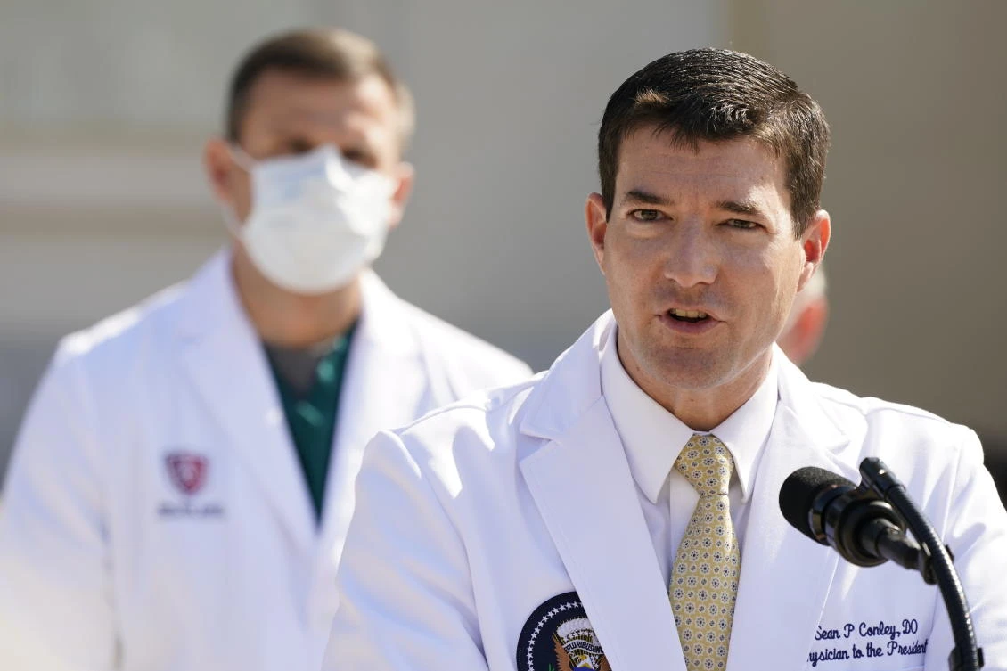 Dr. Sean Conley, physician to President Donald Trump, briefs reporters at Walter Reed National Military Medical Center on Sunday. (AP)
