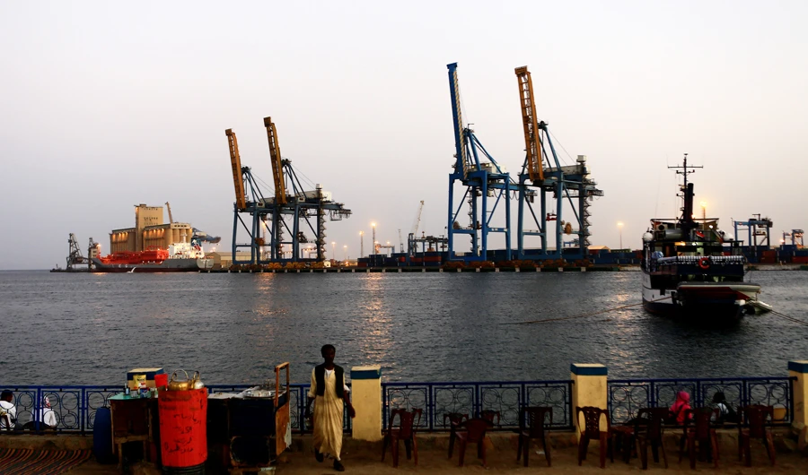A man stands opposite the modern port at the harbour in Port Sudan at Red Sea State February 24, 2014. (REUTERS)