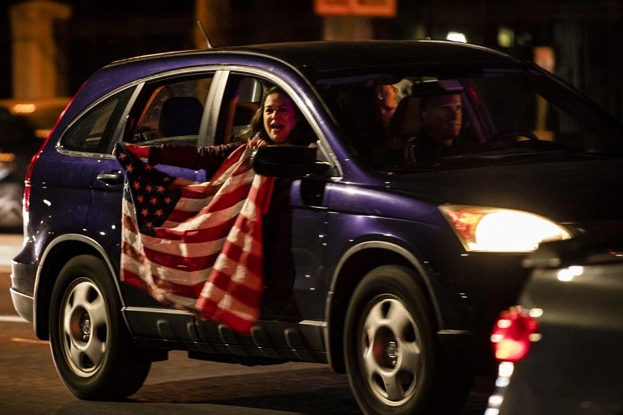 He was masked as he waved from inside his bulletproof vehicle during the short trip outside Walter Reed military medical center near Washington. (File/AFP)
