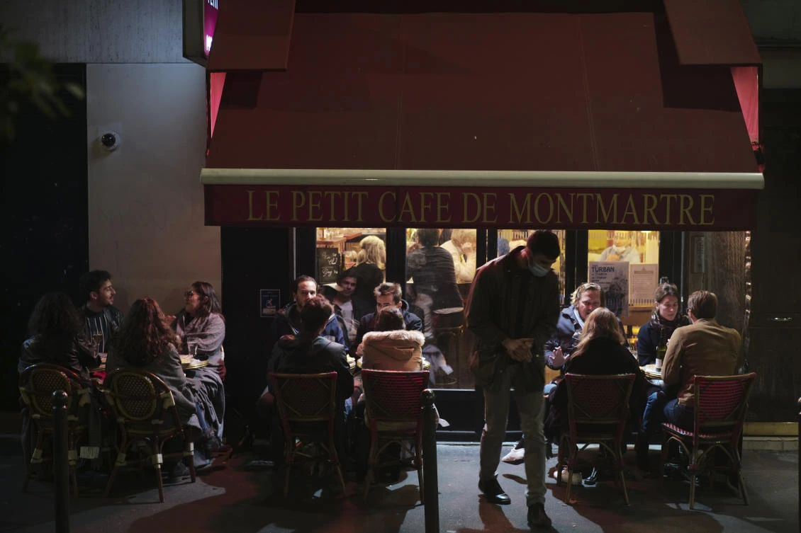 Starting on Tuesday, bars will be closed in Paris and its suburbs while restaurants will remain open under strict conditions. (AP)