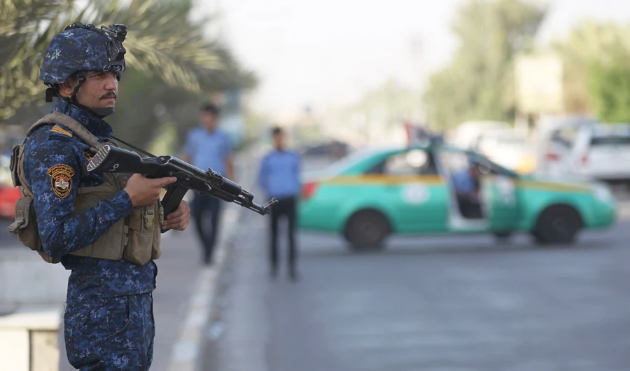 A members of the Iraqi Federal Police patrols the streets of Baghdad's Shula district, in this file photo. (AFP)