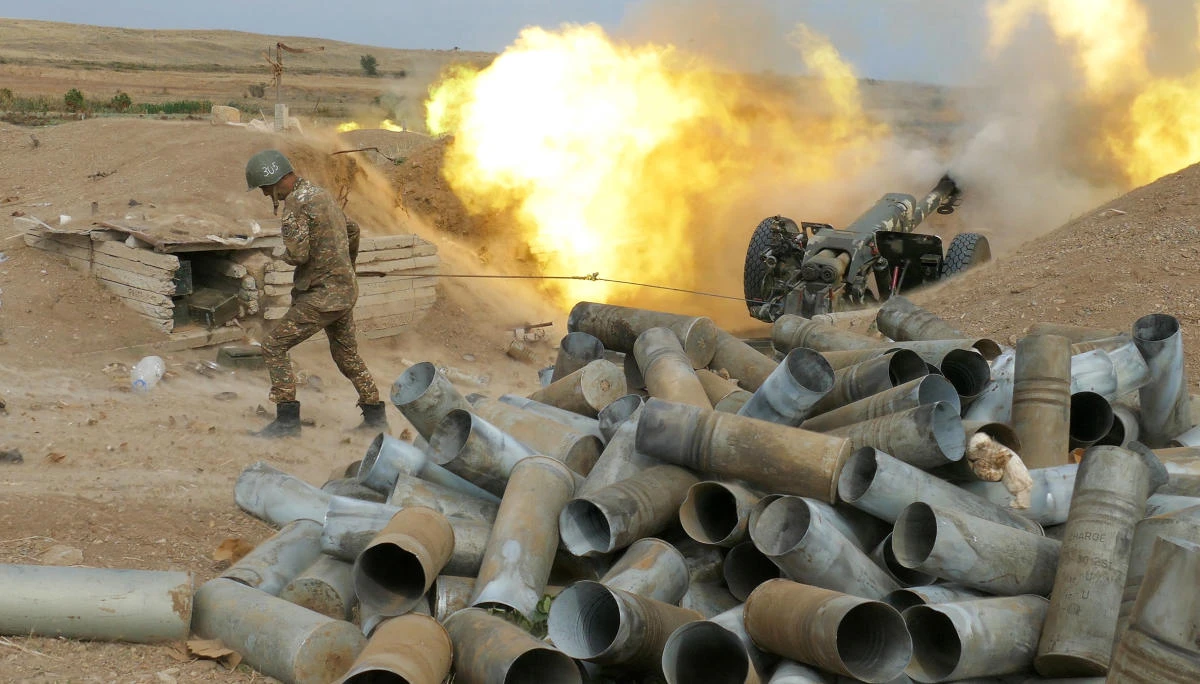 In this Sunday, Oct. 4, 2020 photo, an Armenian soldier fires an artillery piece during fighting with Azerbaijan's forces in self-proclaimed Republic of Nagorno-Karabakh, Azerbaijan. Sunday, Oct. 4, 2020. (AP)