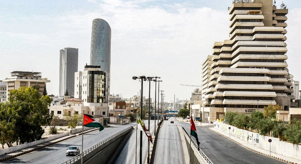 Jordan imposed a 48-hour weekend for the first time in months after a major spike in coronavirus infections. Above, an almost deserted road in Amman on Oct. 9, 2020. (AFP)