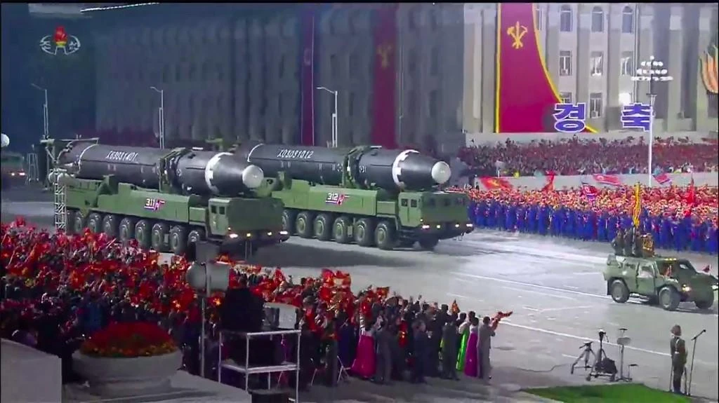 A screen grab taken from a KCNA broadcast on October 10, 2020 shows what appears to be new North Korean intercontinental ballistic missiles on display in Pyongyang. (KCNA via AFP)