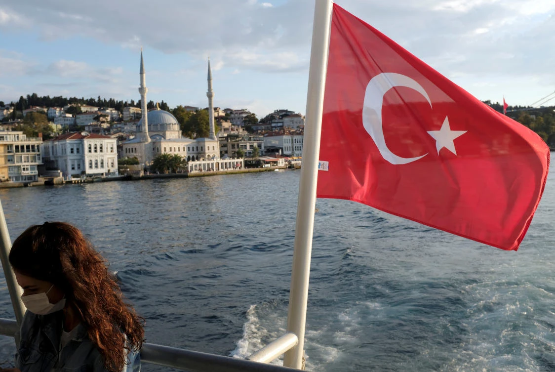 A woman wearing a protective face mask travels on a ferry over the Bosphorus as the outbreak of the coronavirus disease (COVID-19) continues, in Istanbul, Turkey September 30, 2020. (Reuters)