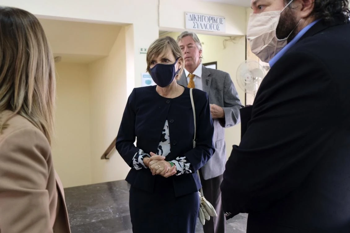 Julie Broaddus Eaton, center, sister of the American scientist Suzanne Eaton, who was murdered in Crete last year, outside the court room in Rethymno, Crete, Oct. 13, 2020. (AP Photo)