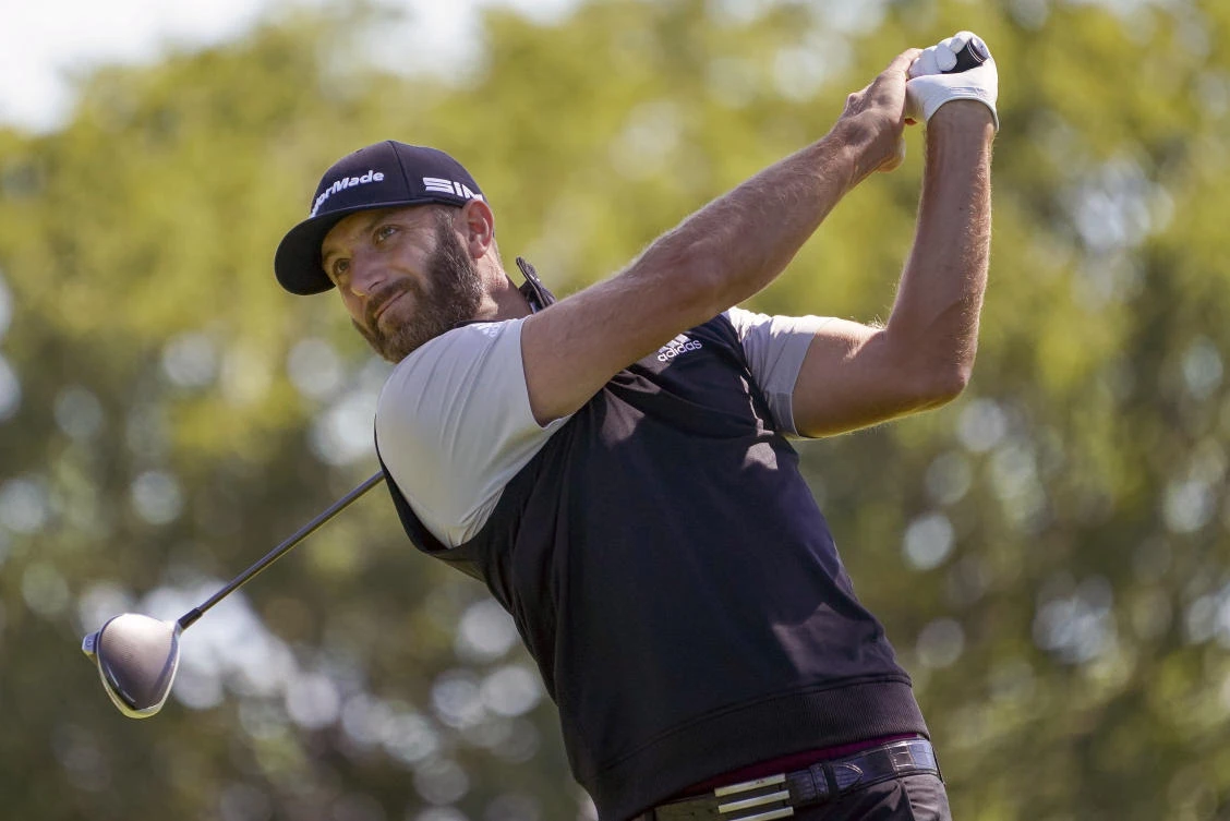 Dustin Johnson hits from the fourth tee during the third round of the US Open Golf Championship, in Mamaroneck, New York, Sept. 19, 2020. (AP Photo)