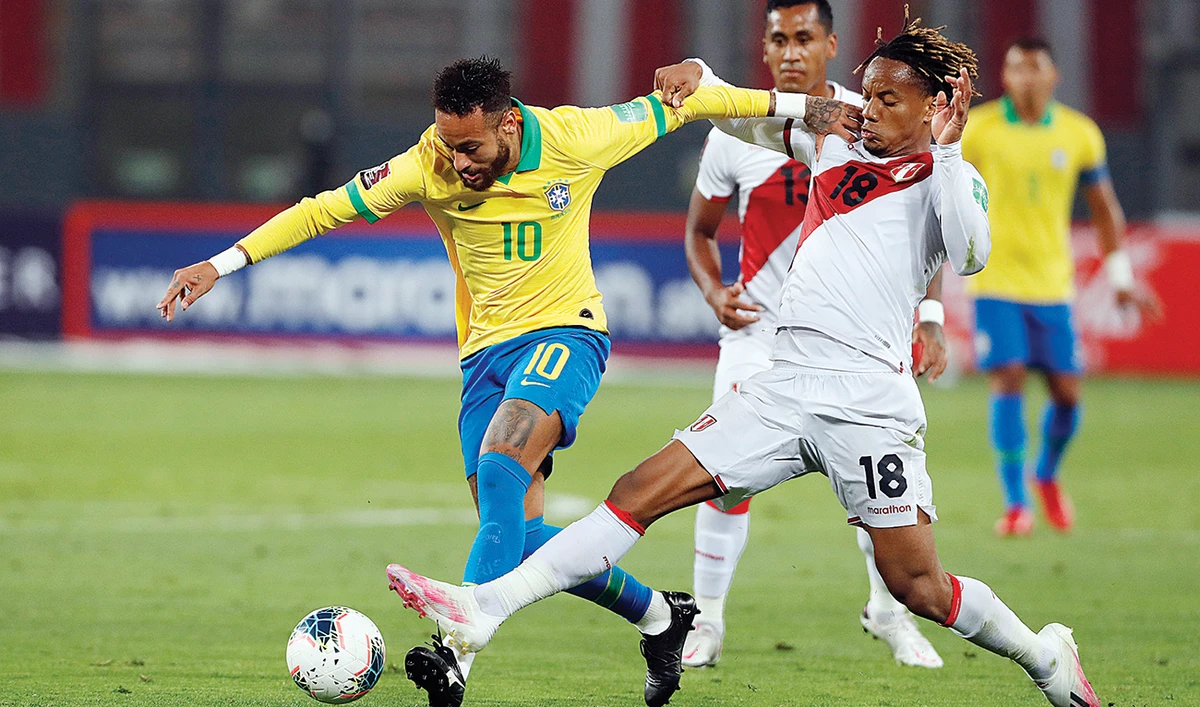 Brazil’s Neymar, left, and Peru’s Andre Carrillo during a qualifying match for the FIFA World Cup 2022 at the National Stadium in Lima on Tuesday. (AP)