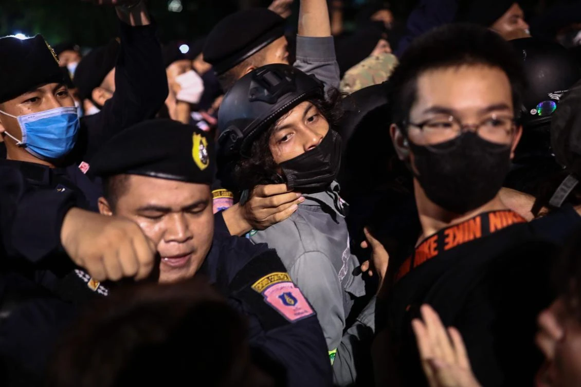 Pro-democracy protesters are jammed up against a line of police as activists push the crowd forward during an anti-government rally in Bangkok on October 14, 2020. (File/AFP)