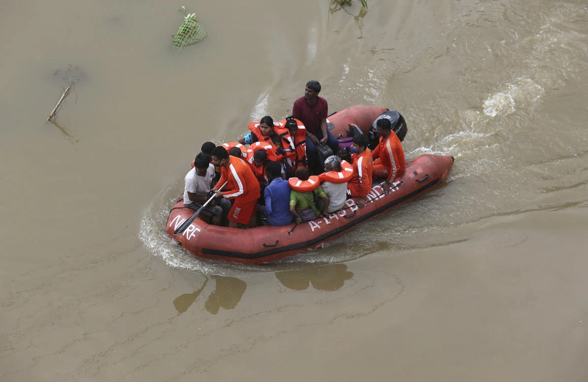 National Disaster Response Force (NDRF) personnel rescue people from floodwaters after heavy rainfall in Hyderabad, India, India, Wednesday, Oct. 14, 2020. (AP)
