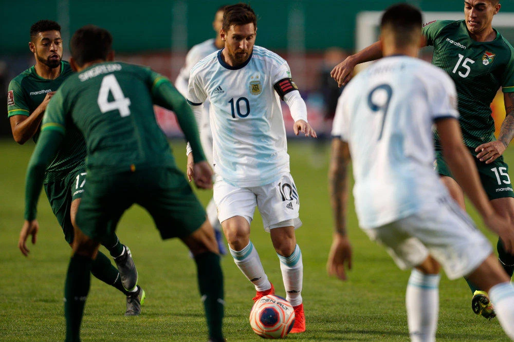 Argentina's Lionel Messi (C) drives the ball during the 2022 FIFA World Cup South American qualifier football match against Bolivia at the Hernando Siles Stadium in La Paz on Oct. 13, 2020, amid the COVID-19 novel coronavirus pandemic. (AFP)