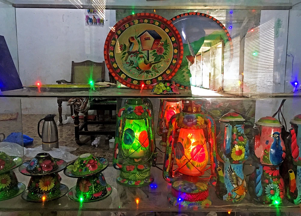 Siyar Khan's ornamental work on lanterns, kettles and teacups is on display at his workshop in Sarband on the outskirts of Peshawar. (AN photo)