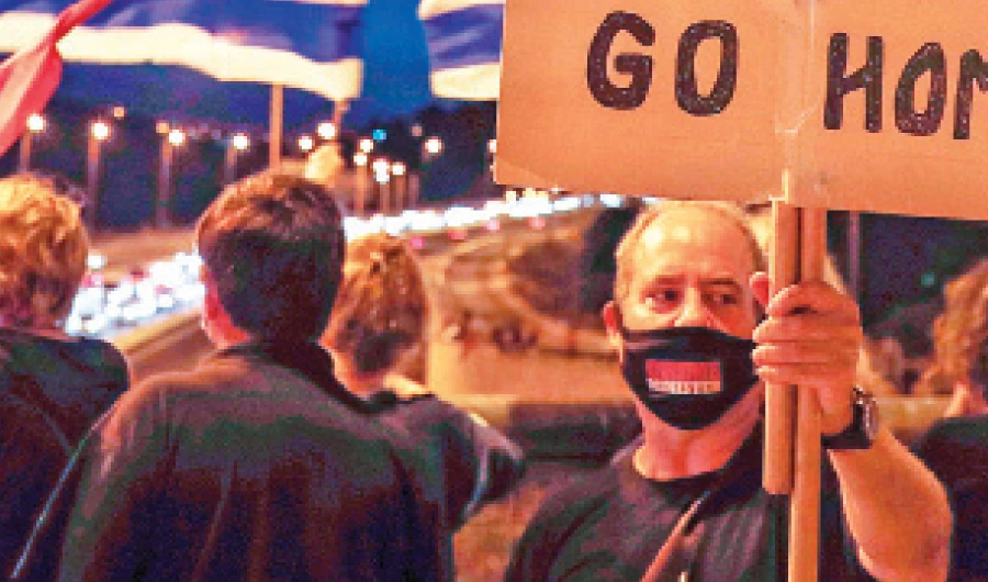 Israeli anti-government protesters rally against the second nationwide lockdown imposed by PM Benjamin Netanyahu, in Jerusalem. (AFP)