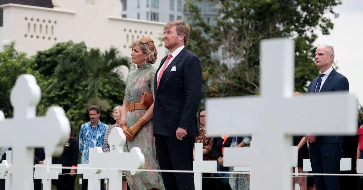 King Willem-Alexander, Queen Maxima and Dutch Foreign Minister Stef Bok, right, during their visit to the Dutch War Cemetery in Jakarta, Indonesia. (AP Photo)