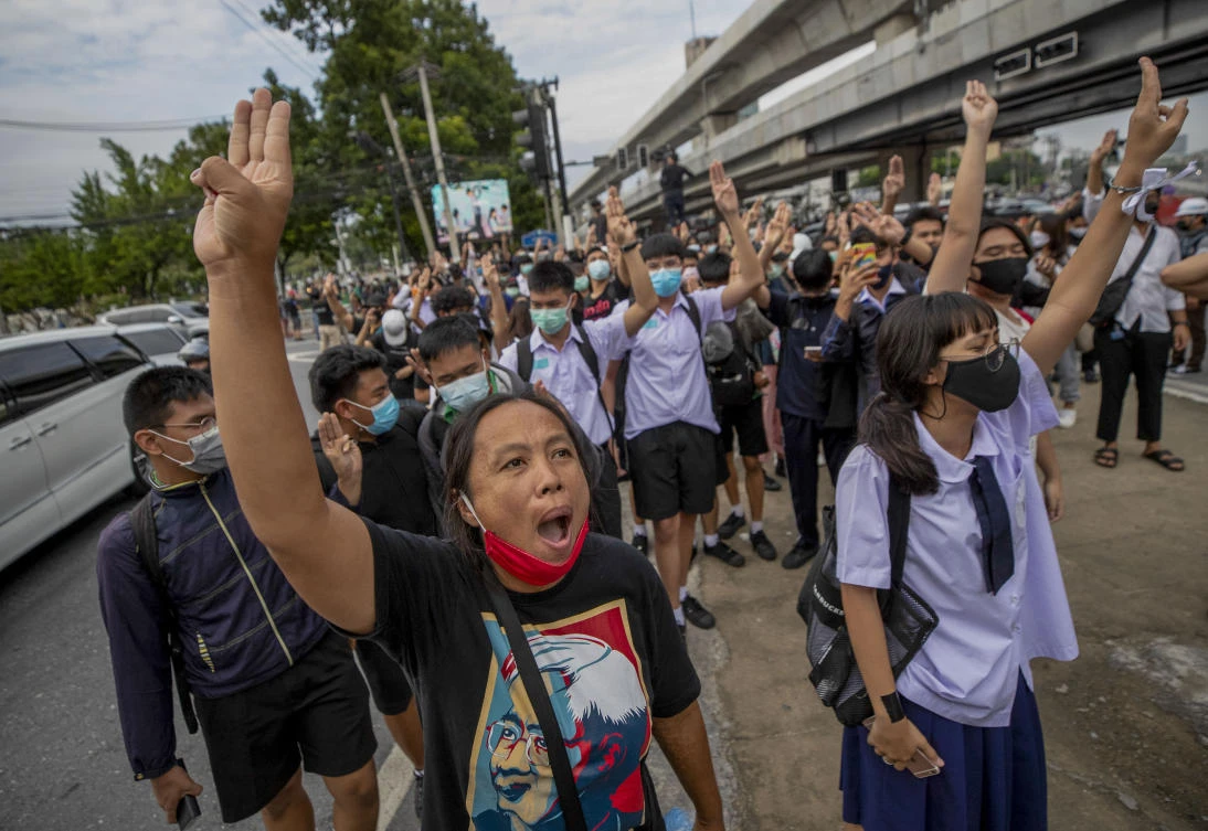 Pro-democracy protesters flash three-fingered salute during a demonstration at Kaset intersection, suburbs of Bangkok, Thailand, Monday, Oct. 19, 2020. (AP)
