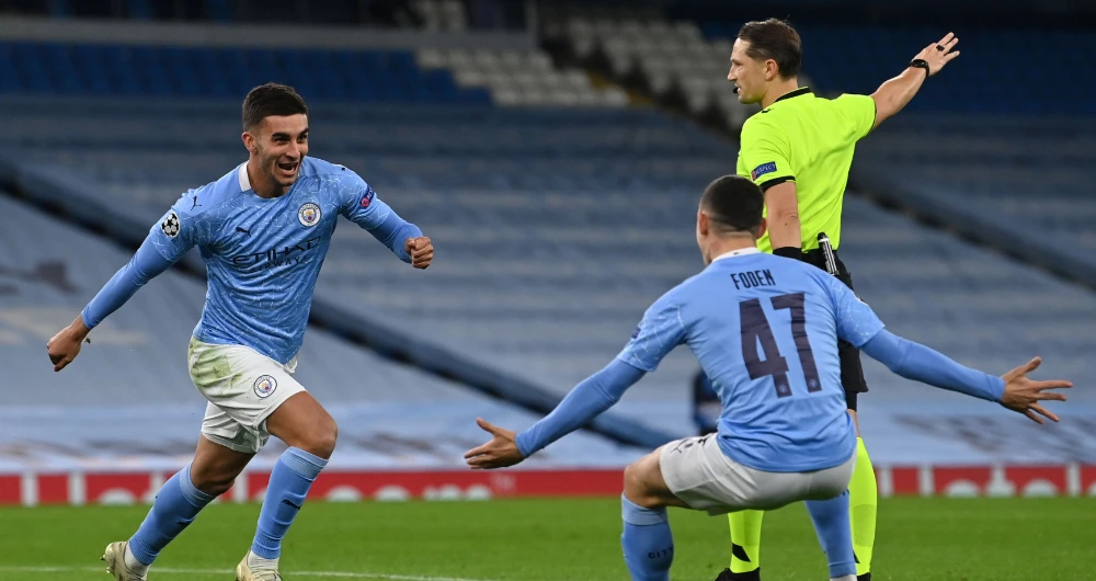 Ferran Torres, left, celebrates with Phil Foden after scoring Man City's third goal. (AFP)