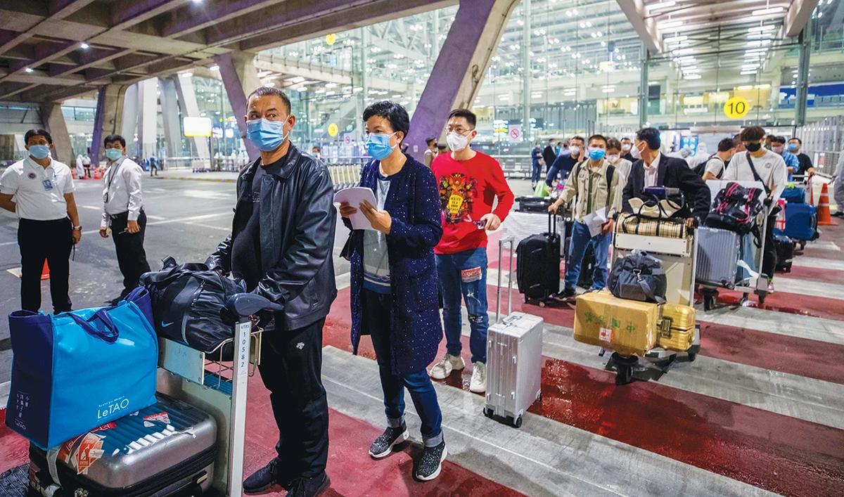 Chinese tourists arrive in Bangkok on special tourist visas, the first arrival since Thailand banned commercial flights almost seven months ago. (AP)