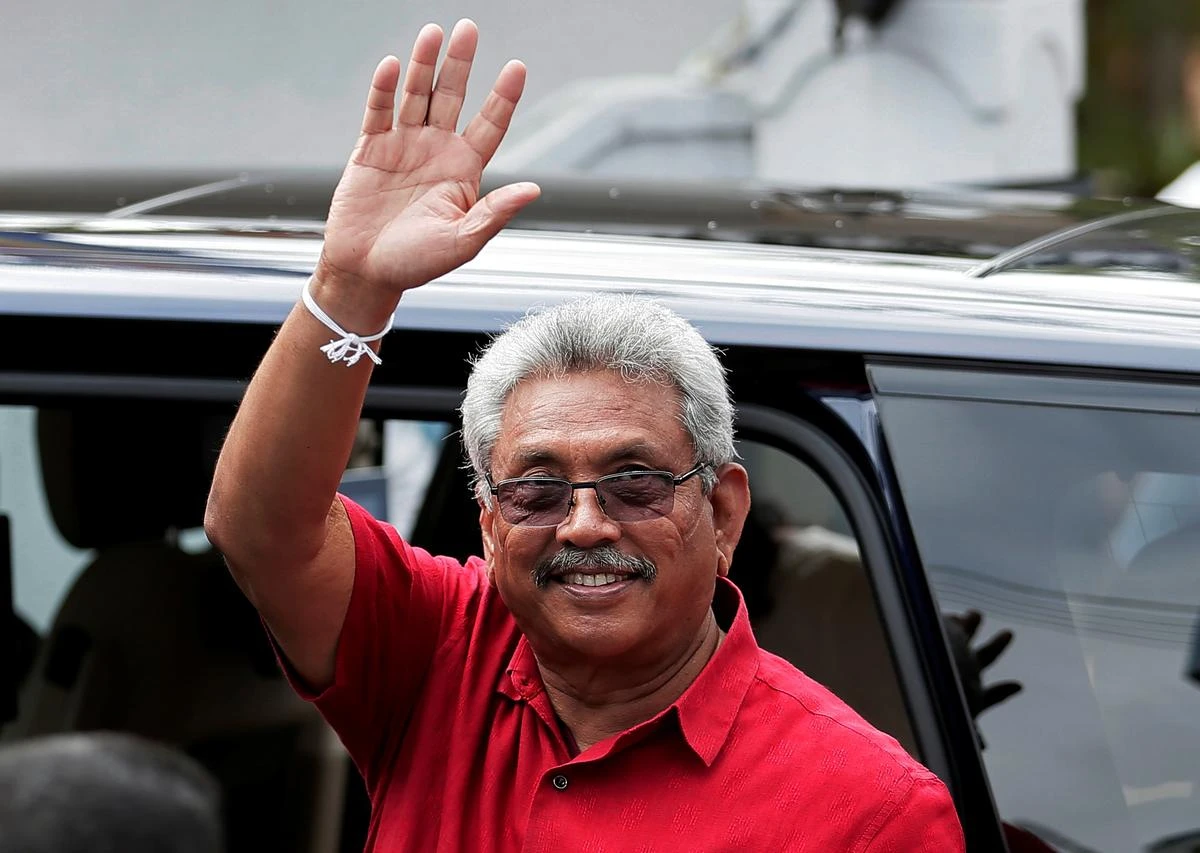 Sri Lanka’s President Gotabaya Rajapaksa waves at his supporters as he leaves a polling station after casting his vote during the country’s parliamentary election in Colombo, Sri Lanka, Aug. 5, 2020. (Reuters)