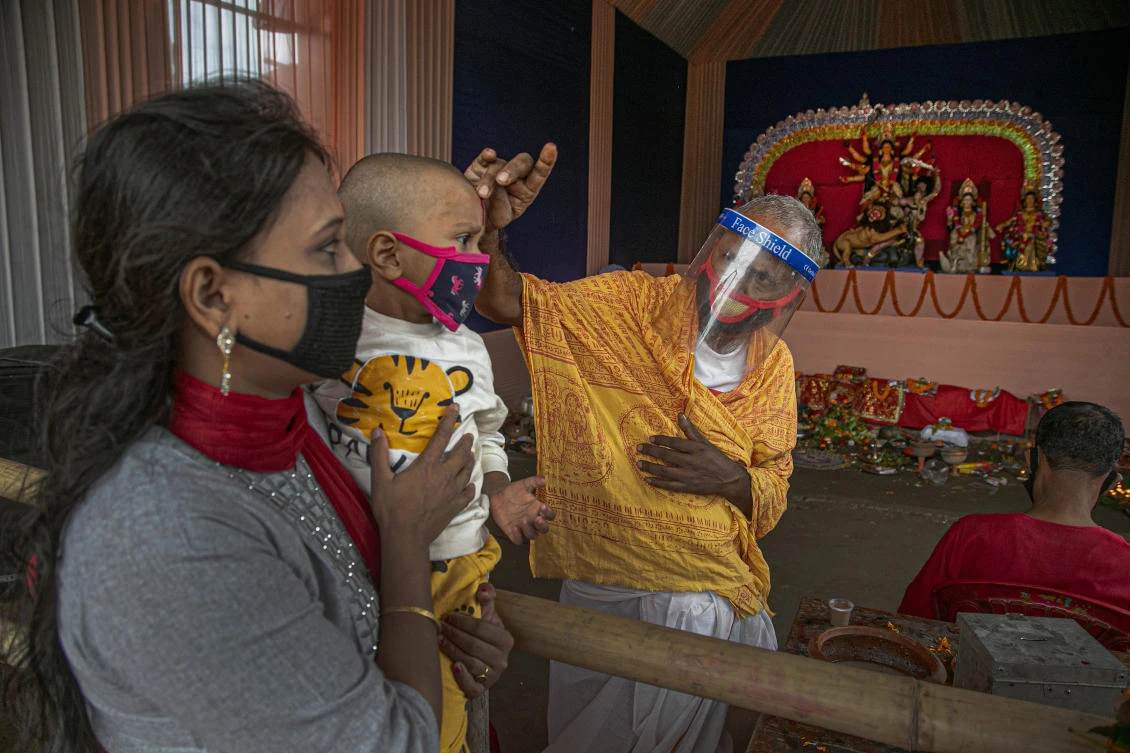 The festivals draw tens and thousands of people, packed together shoulder-to-shoulder in temples, shopping districts and family gatherings, leading to concerns among health experts who warn of a whole new cascade of infections. (AP)