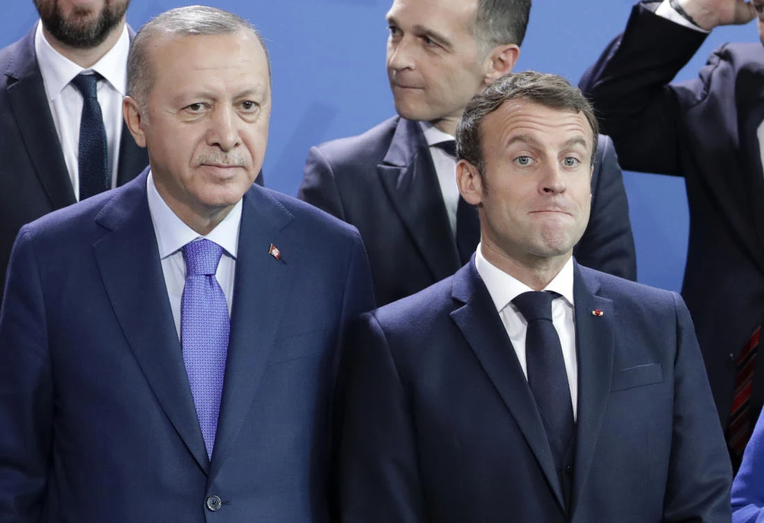 In this Sunday, Jan. 20, 2020 file photo, Turkey's President Recep Tayyip Erdogan, left and French President Emmanuel Macron stand, during a group photo at a conference on Libya at the chancellery in Berlin, Germany. (AP)