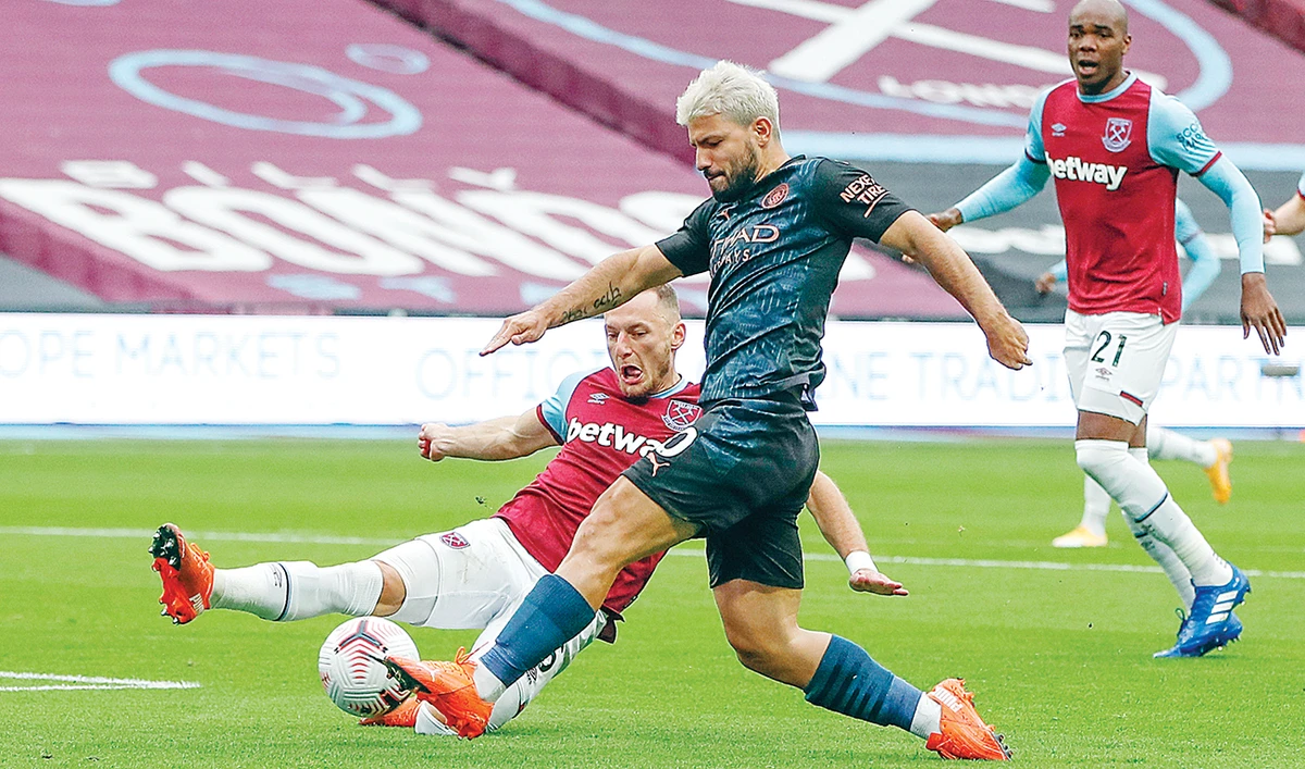Manchester City’s Sergio Aguero, right, and West Ham’s Vladimir Coufal during their English Premier League at the London Olympic Stadium on Saturday. (AP)