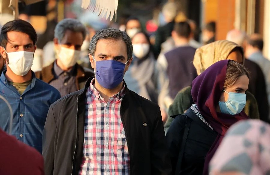 Iranians wear face masks as a Covid-19 coronavirus pandemic precaution, in Iran's capital Tehran on October 19, 2020. (File/AFP)