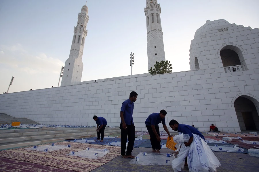 Workers clean after the Iftar meal during the holy month of Ramadan on May 09, 2019 in the Omani capital Muscat. (File/AFP)