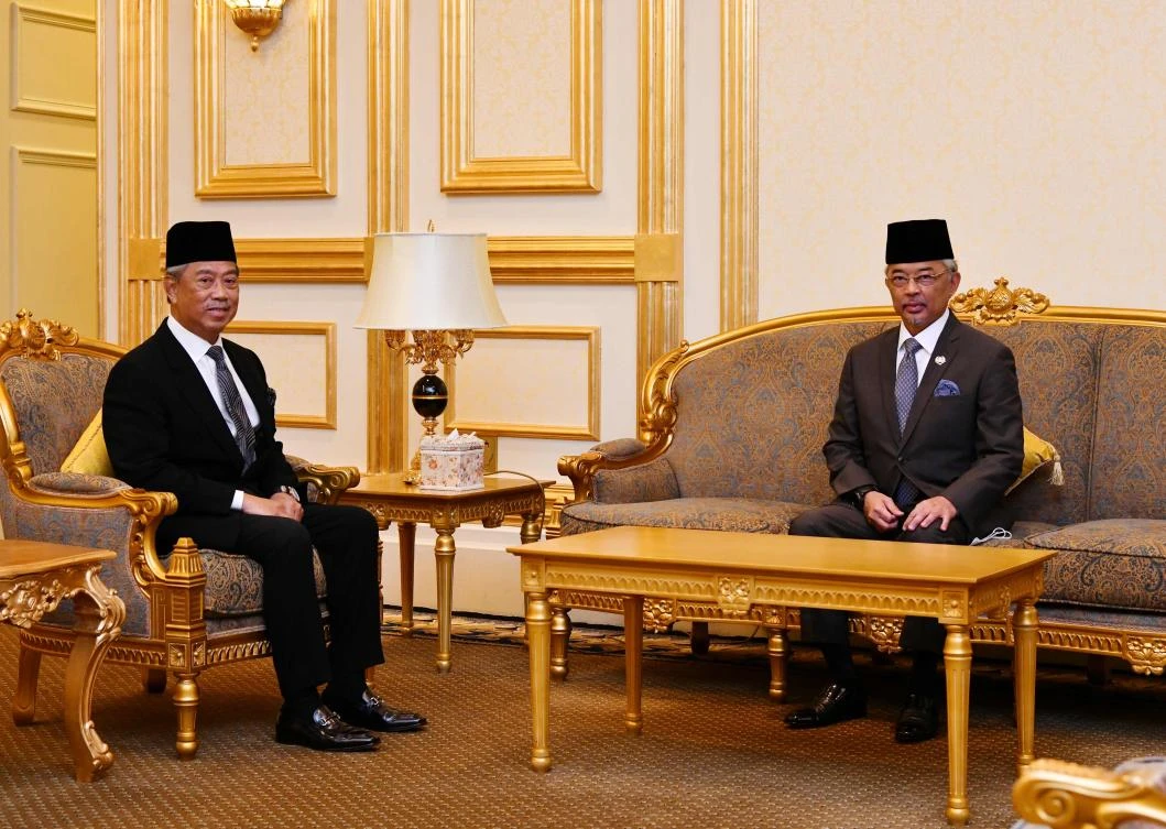 This handout picture released by the National Palace on Oct.28, 2020 shows Malaysia Prime Minister Muhyiddin Yassin, left, with Malaysia’s King Al-Sultan Abdullah prior to their meeting in Kuala Lumpur. (Malaysia National Palace/AFP)