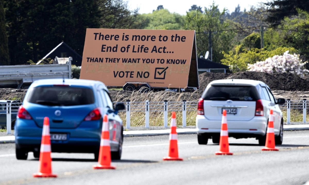 In this Oct. 16, 2020, file photo, cars are driven past a billboard urging voters to vote "No" against euthanasia in Christchurch, New Zealand. New Zealanders have voted on Friday, Oct. 30, 2020 in favor of legalizing euthanasia in a binding referendum. (AP Photo/Mark Baker, File)