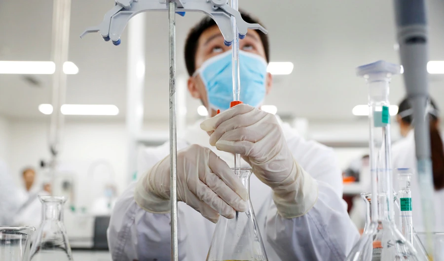 A man works in a laboratory of Chinese vaccine maker Sinovac Biotech, developing an experimental coronavirus disease (COVID-19) vaccine, during a government-organized media tour in Beijing, China, September 24, 2020. (REUTERS)