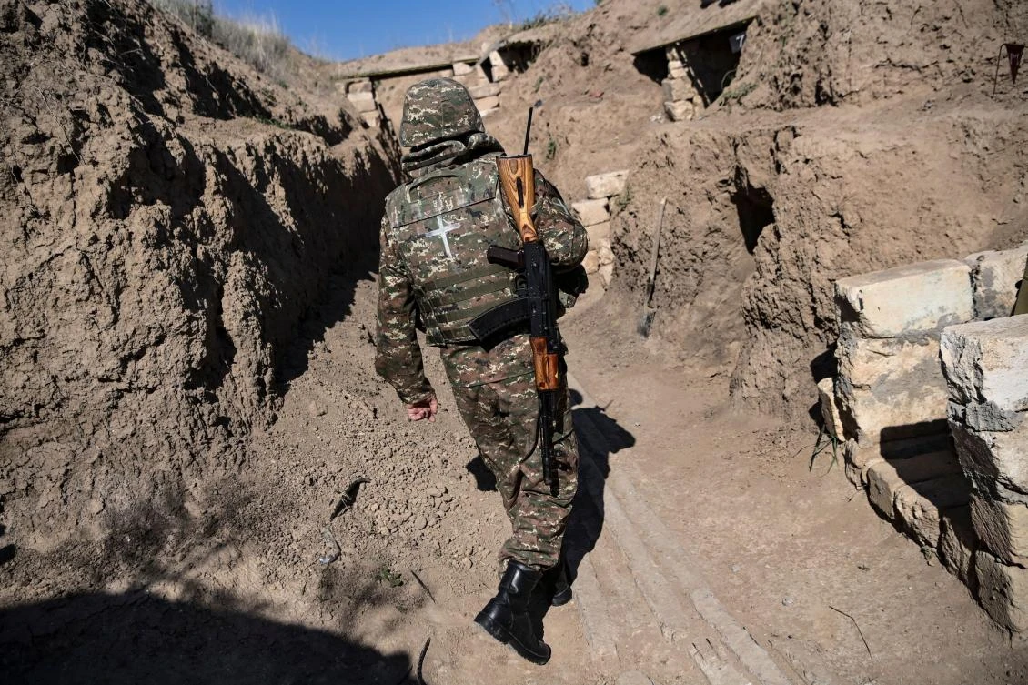 In this file photo taken on October 25, 2020 an Armenian soldier walks as troops hold positions on the front line during the ongoing fighting between Armenian and Azerbaijani forces over the breakaway region of Nagorno-Karabakh. (File/AFP)