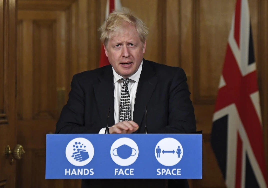 Britain's Prime Minister Boris Johnson speaks during a press conference in 10 Downing Street, London, Saturday, Oct. 31, 2020 where he is expected to announce new restrictions to help combat a coronavirus surge. (AP)
