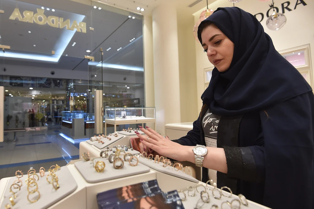 Saudi Rodina Maamoun, who employed 19 young women almost entirely replacing the men, sells jewellery at a retail store in Riyadh's Hayat mall on February 19, 2020. (AFP/File Photo)