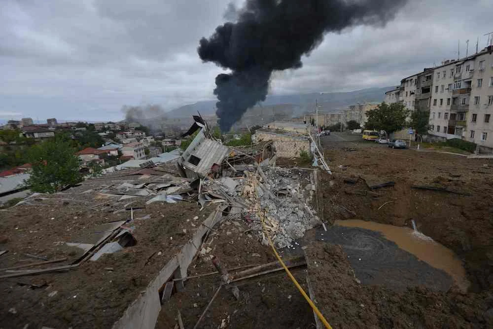 The aftermath of shelling during fighting between Armenia and Azerbaijan over the breakaway Nagorno-Karabakh region, in the disputed region's main city of Stepanakert on Sunday. (AFP)