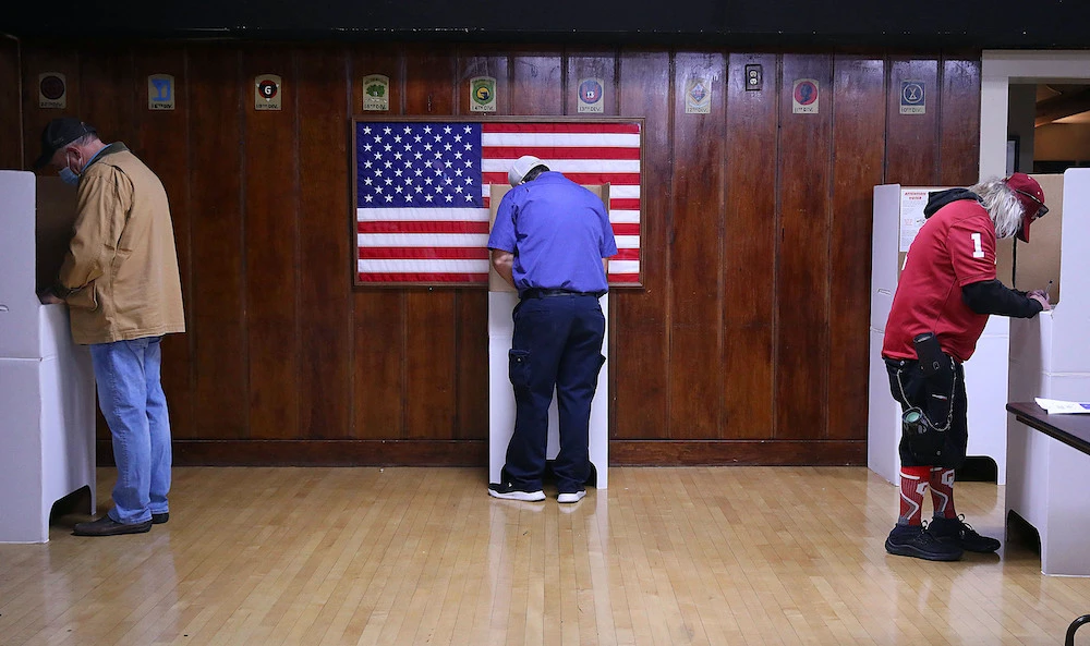 Voters fill out their ballots at American Legion Post 1 on Election Day in Tulsa, Oklahoma Tuesday, Nov. 3, 2020. (Tulsa World via AP)