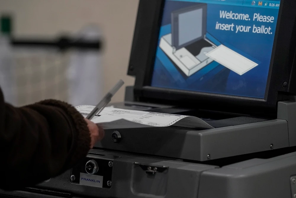 A voter casts their ballot on Election Day, at the Milwaukee County Sports Complex Tuesday, Nov. 3, 2020, in Franklin, Wisconsin. (AP)