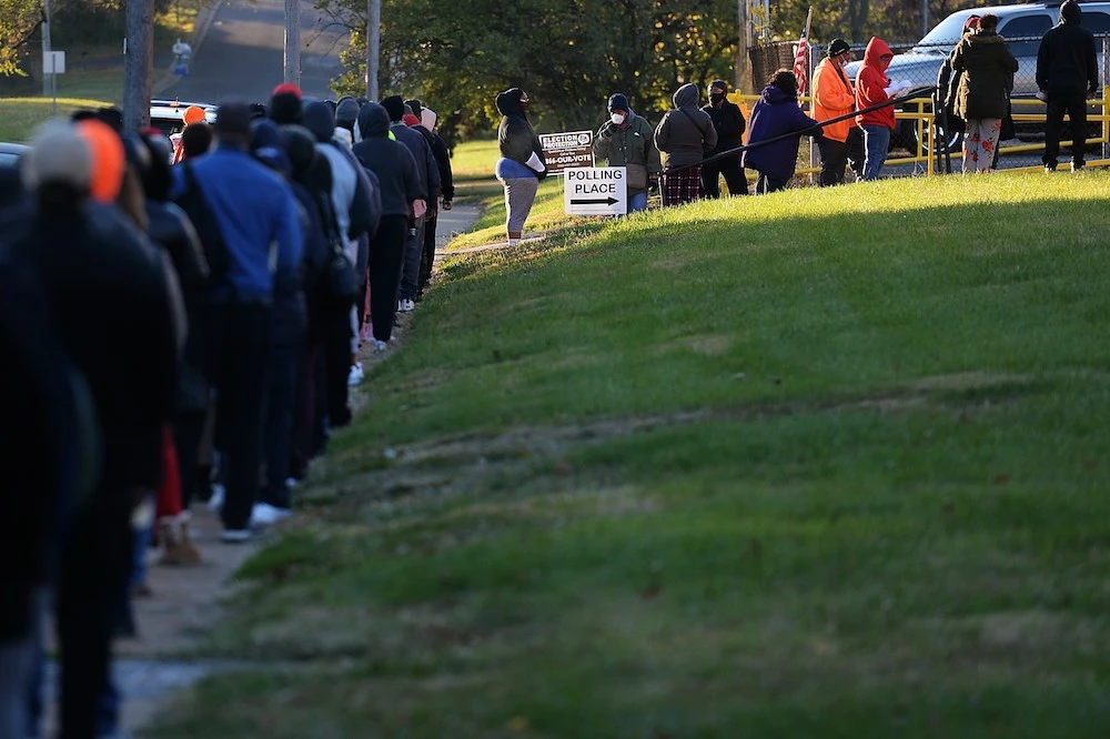 Voters wait on line to cast their ballots on Election Day on Nov. 3, 2020 at Jennings Senior High School in St. Louis, Missouri. (AFP)