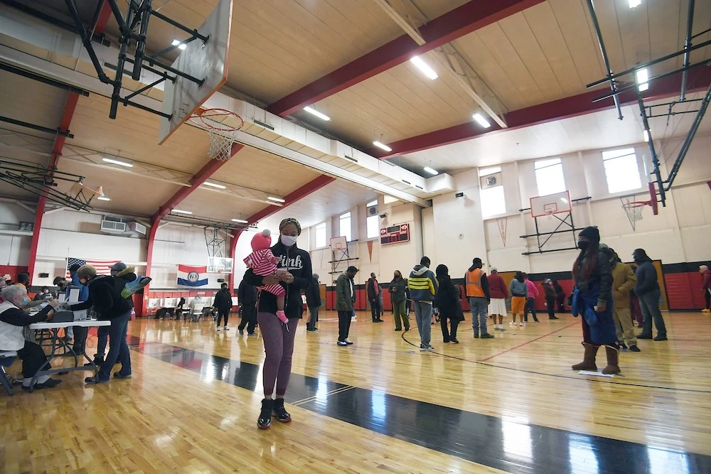 Voters wait on line to cast their ballots on Election Day on Nov. 3, 2020 at Jennings Senior High School in St. Louis, Missouri. (AFP)