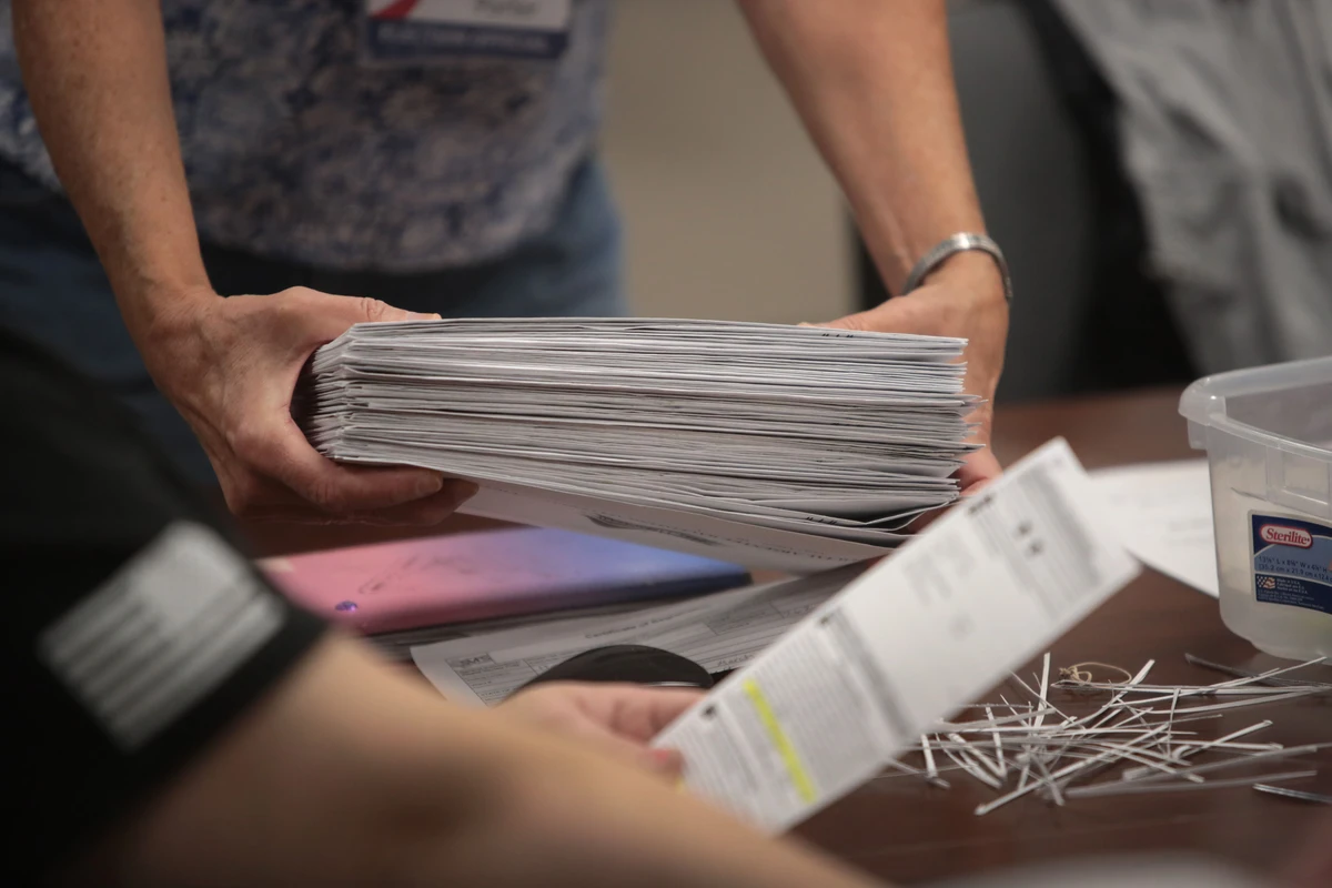 Election officials begin counting absentee ballots at City Hall on Nov. 03, 2020 in Beloit, Wisconsin. Wisconsin requires election officials to wait to begin counting these votes until after polls open on election day. (Getty Images/AFP)