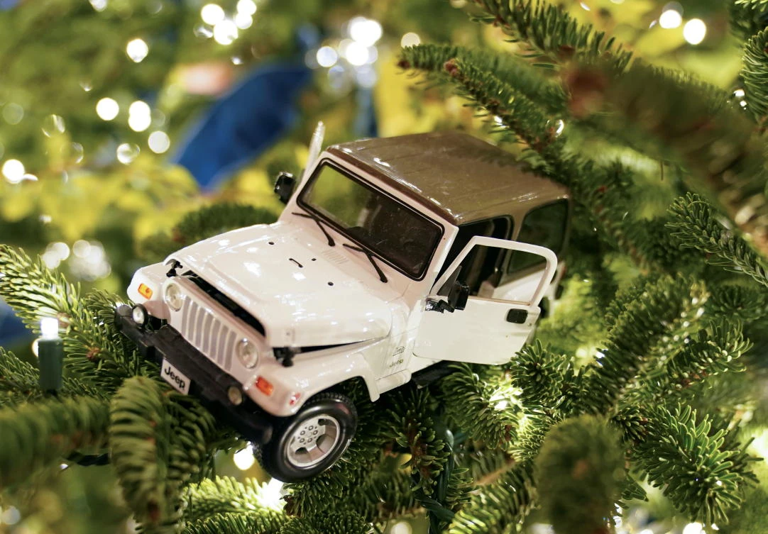 A Jeep ornament sits in a Christmas tree in the East Room of the White House during a holiday decoration preview in Washington, U.S., November 30, 2020. REUTERS/Kevin Lamarque