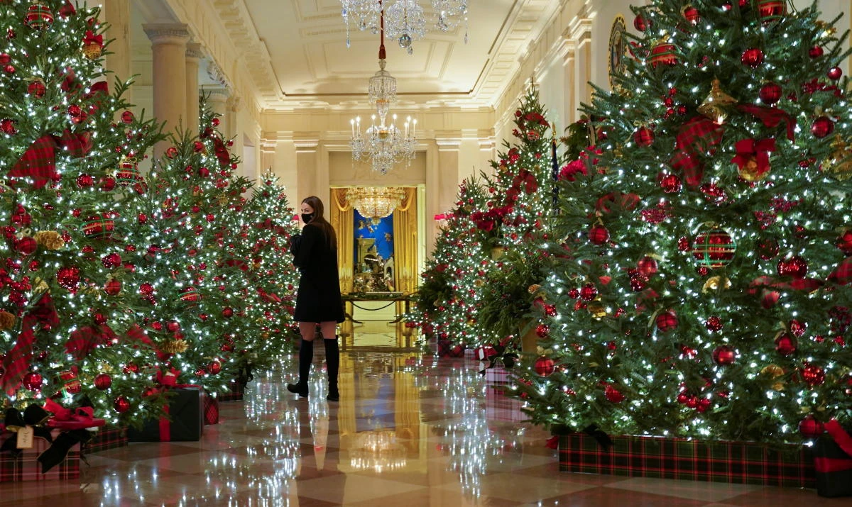 The Cross Hall of the White House is adorned with holiday decorations during a press preview in Washington, U.S., November 30, 2020. REUTERS/Kevin Lamarque