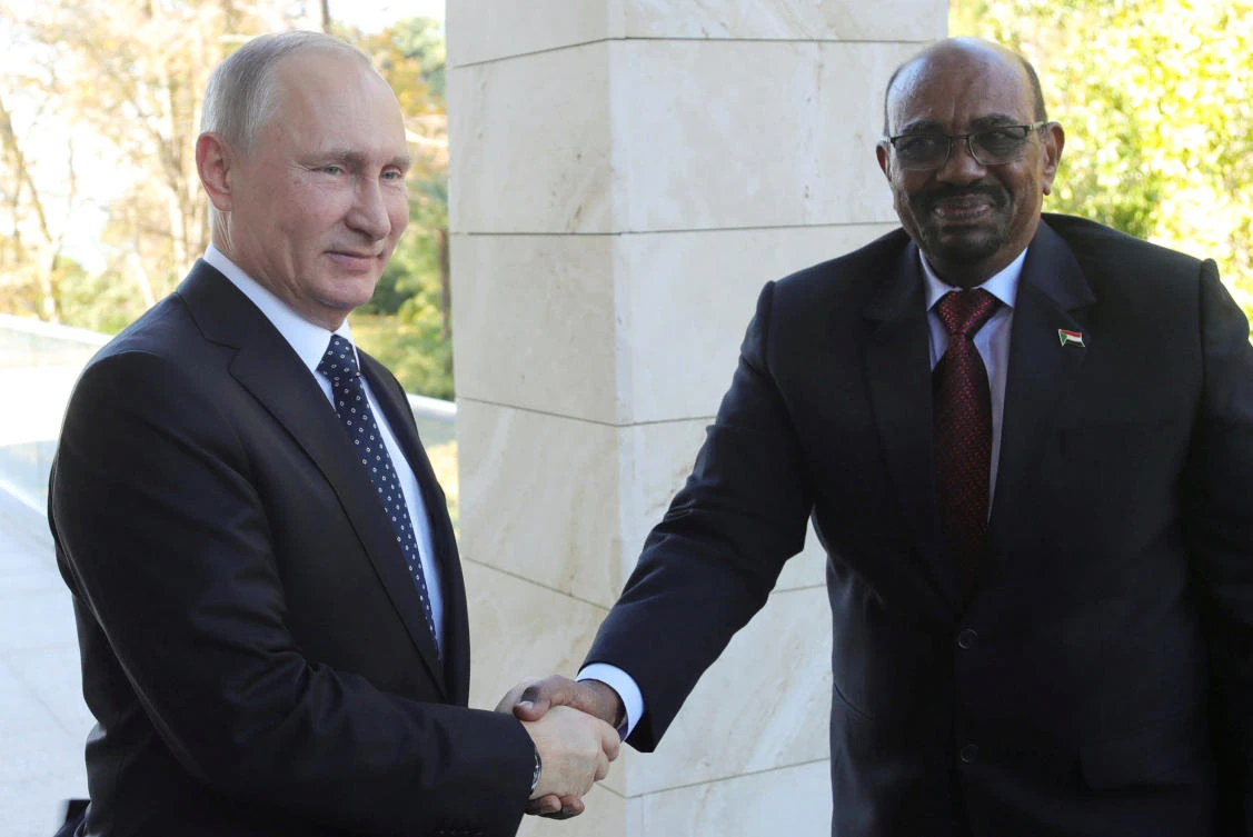 Russian President Vladimir Putin shakes hands with Sudan's President Omar al-Bashir during their meeting in the Black Sea resort of Sochi, Russia. (Sputnik via Reuters)