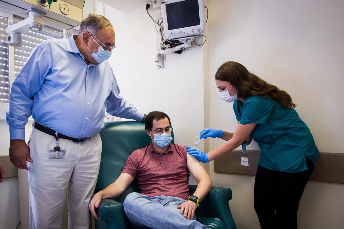 Anar Ottolenghi, 34, one of the volunteers taking part in Israel’s human trials for its coronavirus disease (COVID-19) vaccine candidate, receives the potential vaccine at Hadassah Medical Center in Jerusalem November 1, 2020. (Reuters)