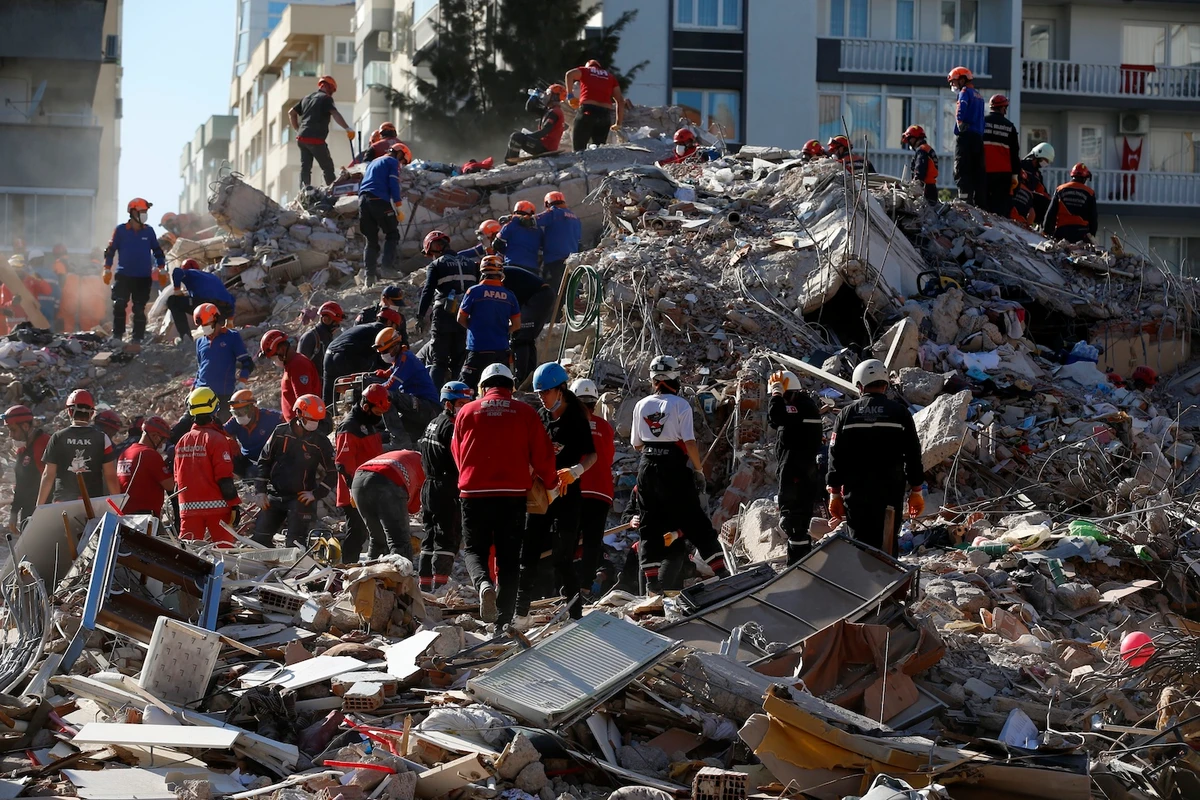 Members of rescue services search in the debris of a collapsed building for survivors in Izmir, Turkey, Sunday, Nov. 1, 2020. (AP)