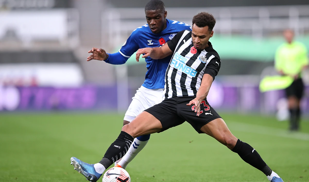 Newcastle’s Jacob Murphy, front, and Everton’s Niels Nkounkou during their match on Sunday. (AP)