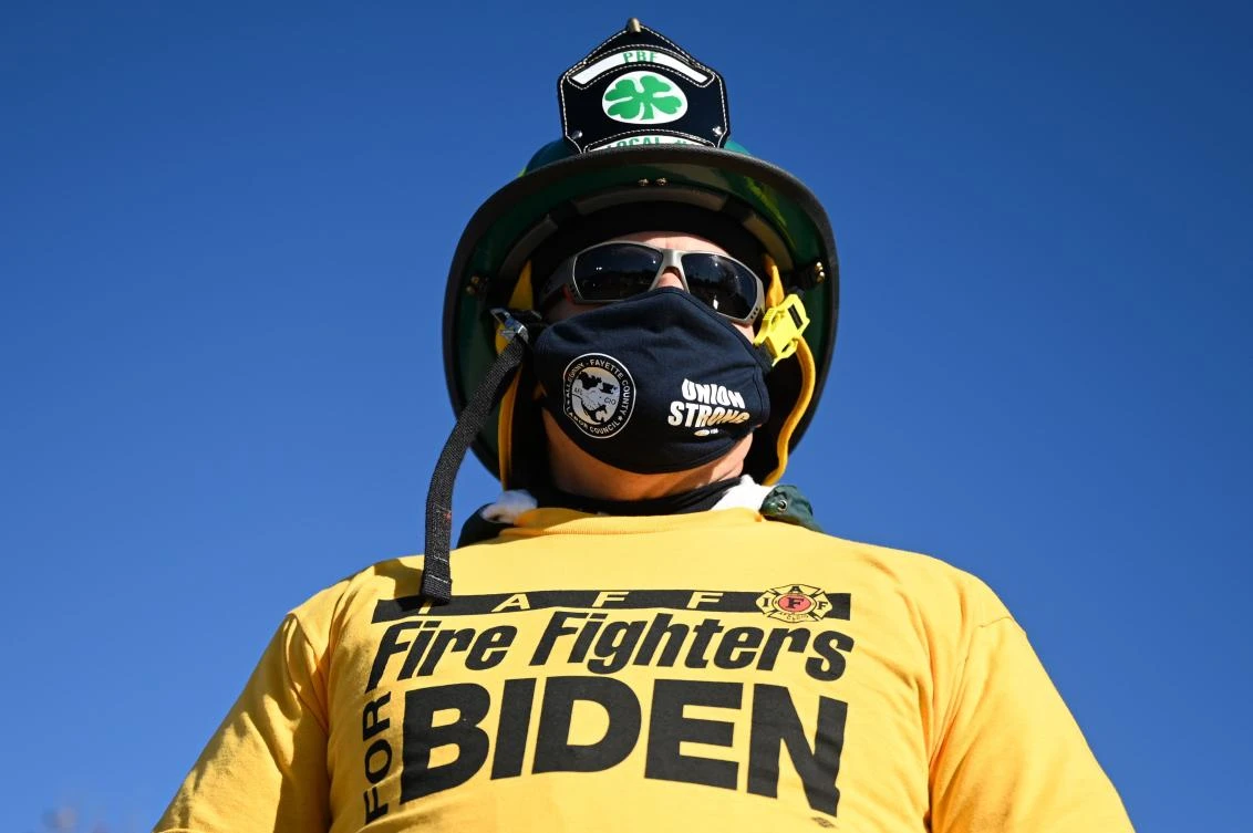 Firefighter Tom Wosko waits for the arrival of Democratic Presidential Candidate Joe Biden at canvassing event at Community College of Beaver County in Monaca, Pennsylvania on Monday. (AFP)