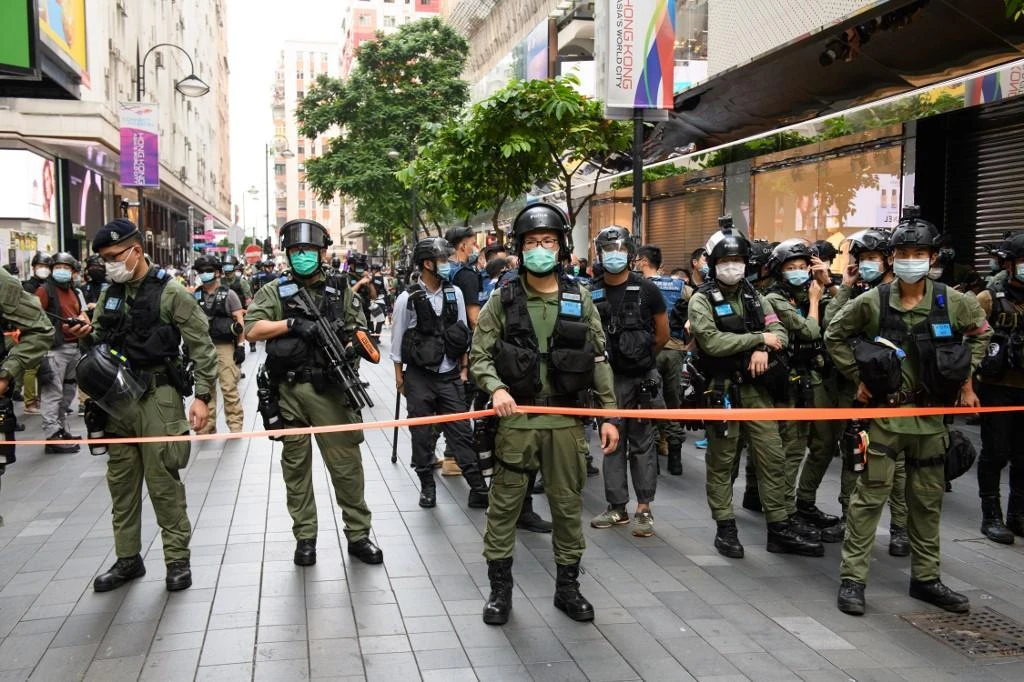 Police became a key target for protesters as clashes raged, especially after officers stopped wearing identification badges. (AFP)