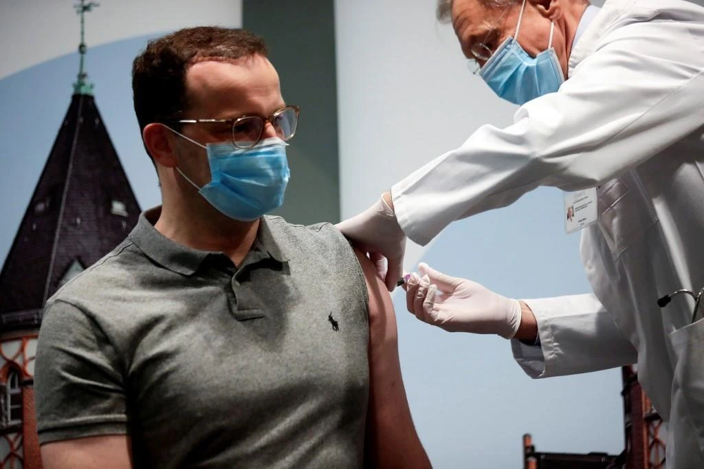 German Health Minister Jens Spahn (L) receives an influenza vaccination from physician Harald Bias, Head of Occupational Medicine Center at Charite University Hospital in Berlin, on October 14, 2020, amid the ongoing coronavirus COVID-19 pandemic. (File/AFP)